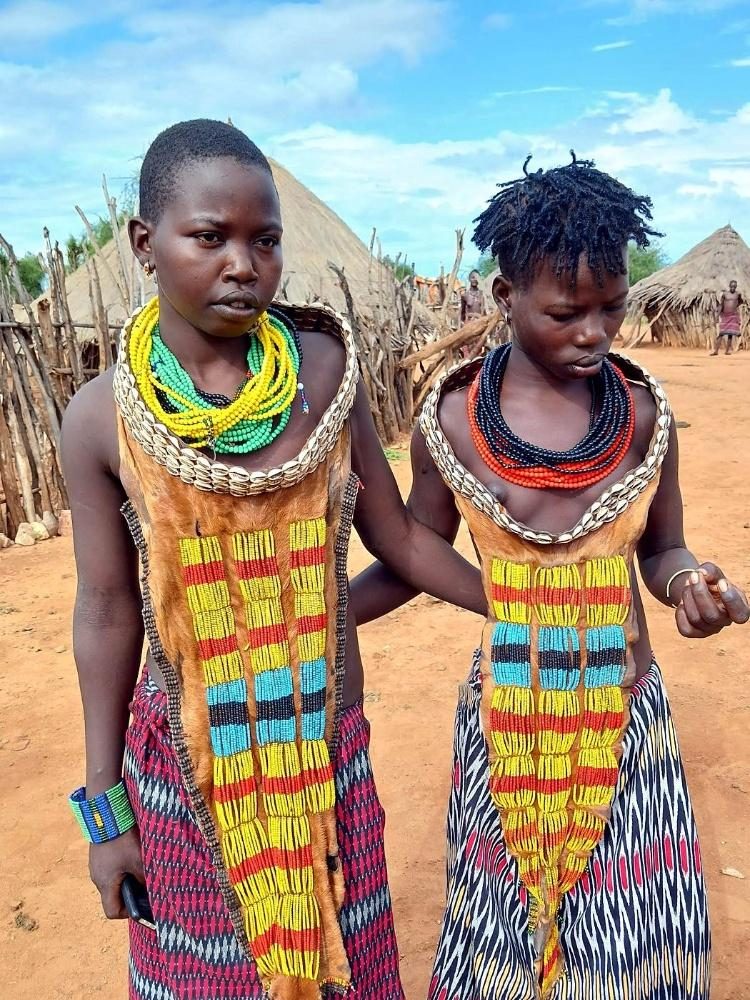 Two women in traditional beaded dress in the Omo Valley